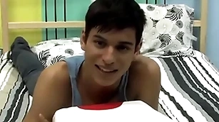 Cute twink is playing with his cock by way of an interview